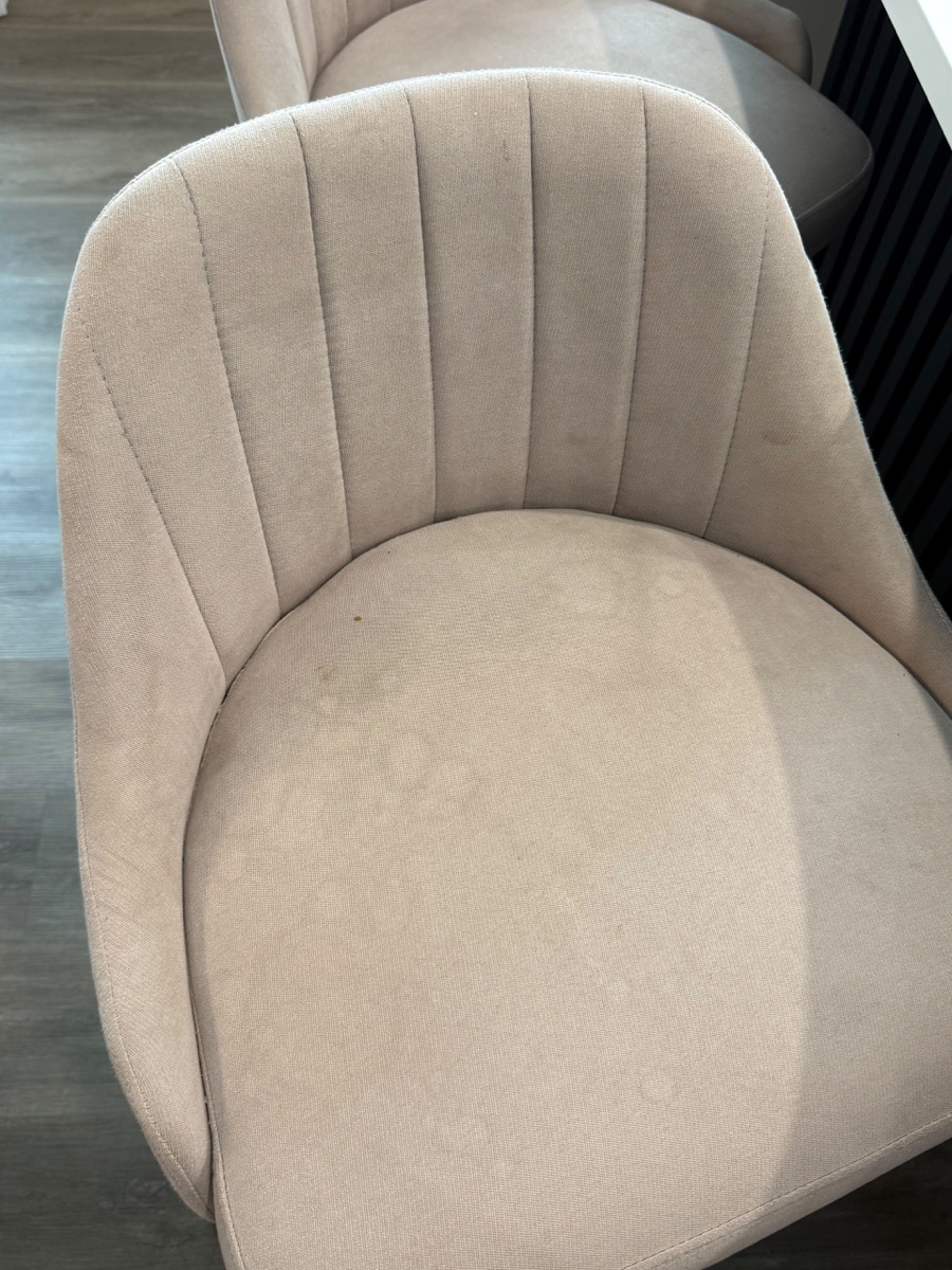 Upholstered chair with marks before cleaning