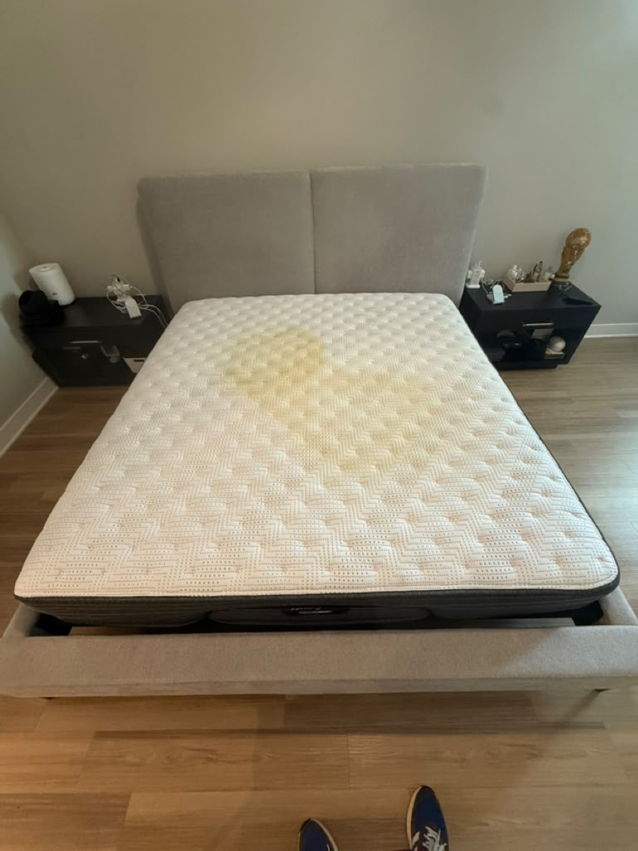 Mattress with a yellow stain before cleaning